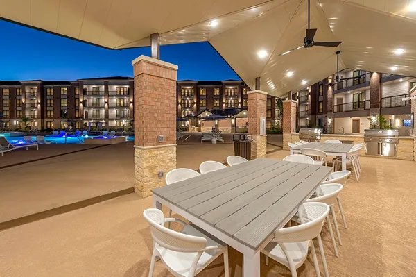a dinning table and chairs in the patio