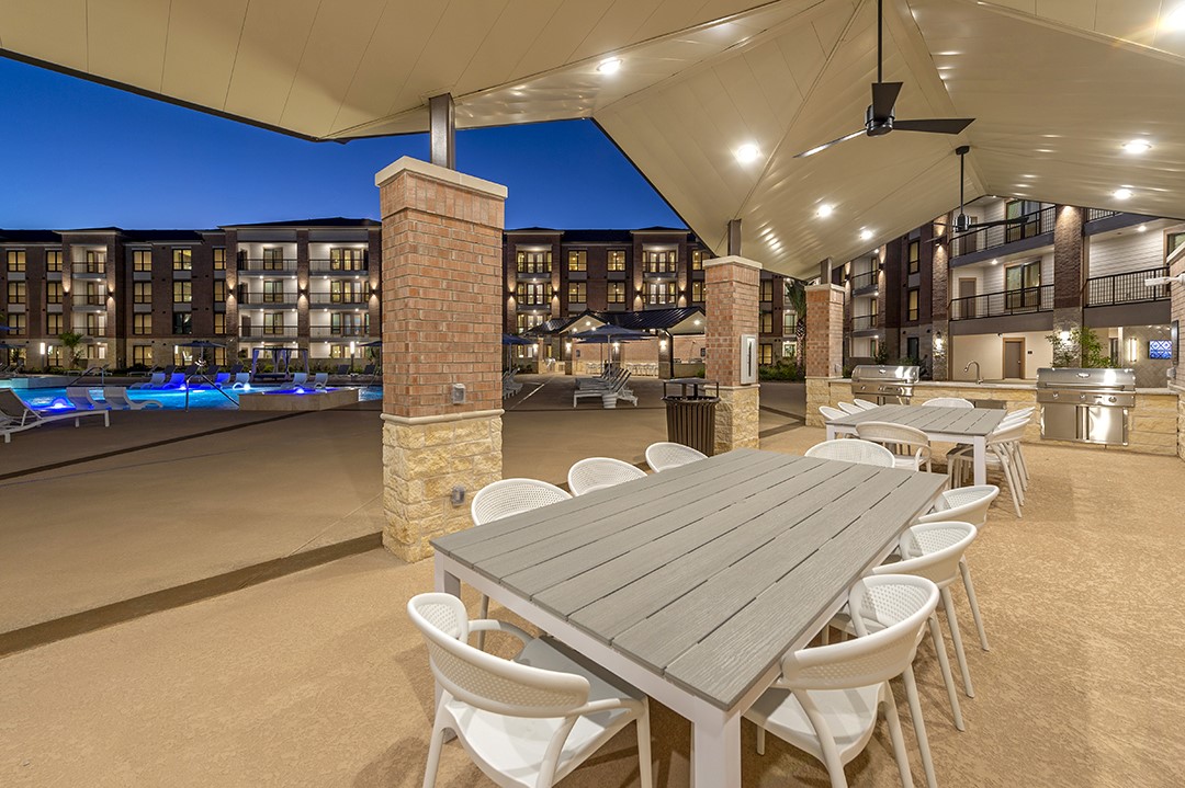 1724 Partnership Way, Unit 2102 Katy, TX 77449 - Photo 22 of 33 a dinning table and chairs in the patio