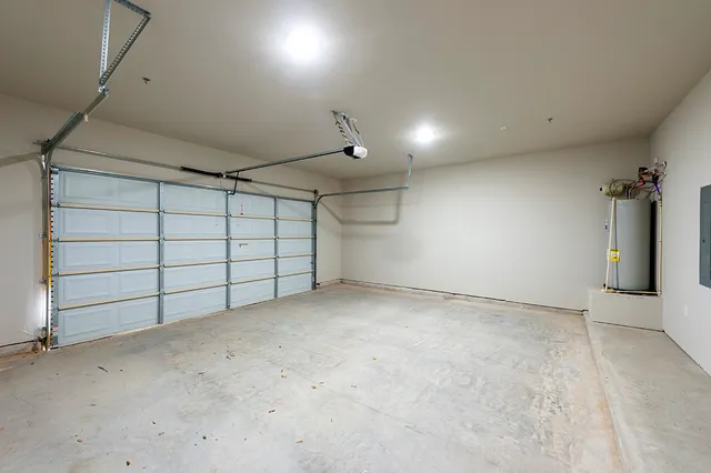 a bathroom with a granite countertop sink toilet mirror and bathtub