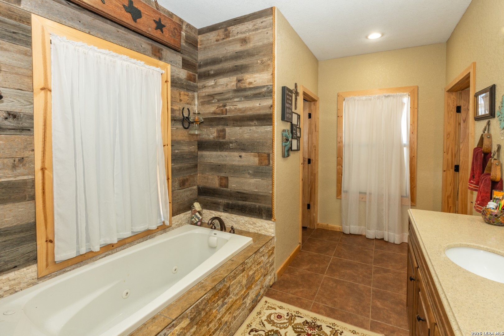 1079 County Road 357 Utopia, TX 78884 - Photo 16 of 36 a bathroom with a tub and shower