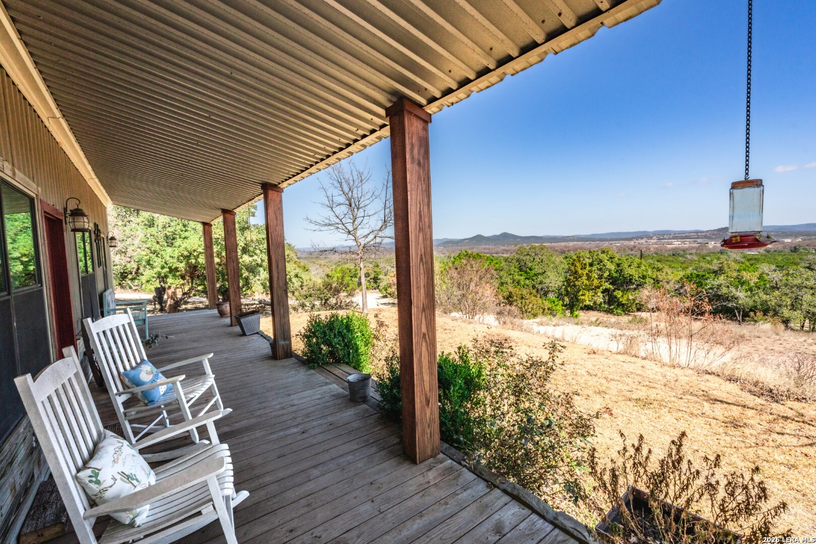 1079 County Road 357 Utopia, TX 78884 - Photo 21 of 36 a view of a patio with table and chairs and wooden floor