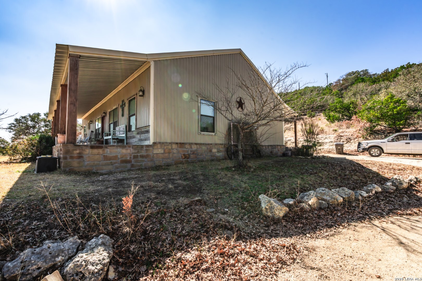 1079 County Road 357 Utopia, TX 78884 - Photo 23 of 36 a view of a house with a yard