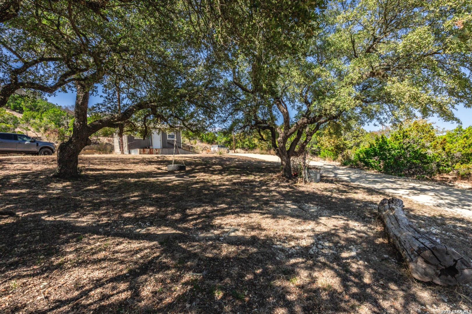 1079 County Road 357 Utopia, TX 78884 - Photo 24 of 36 a view of outdoor space with deck and tree