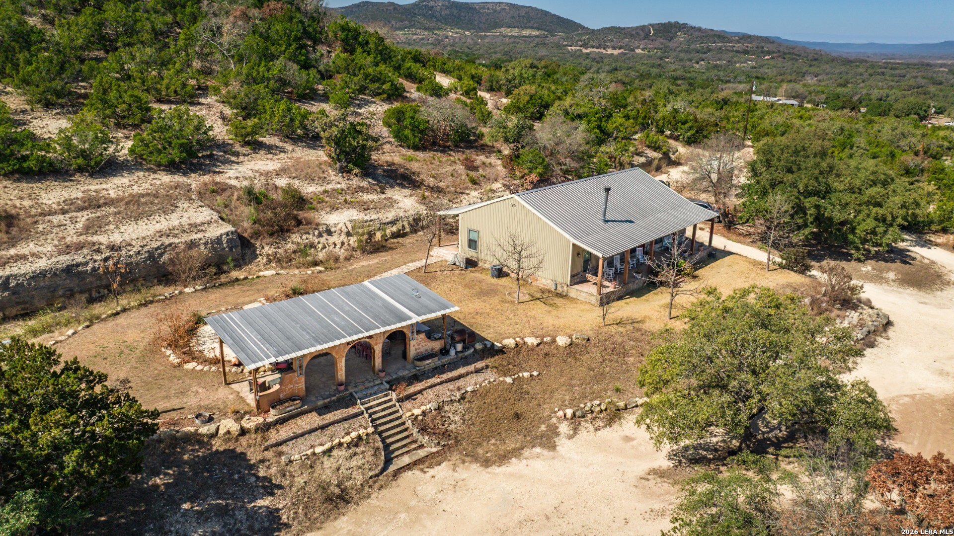 1079 County Road 357 Utopia, TX 78884 - Photo 30 of 36 an aerial view of a house with a yard