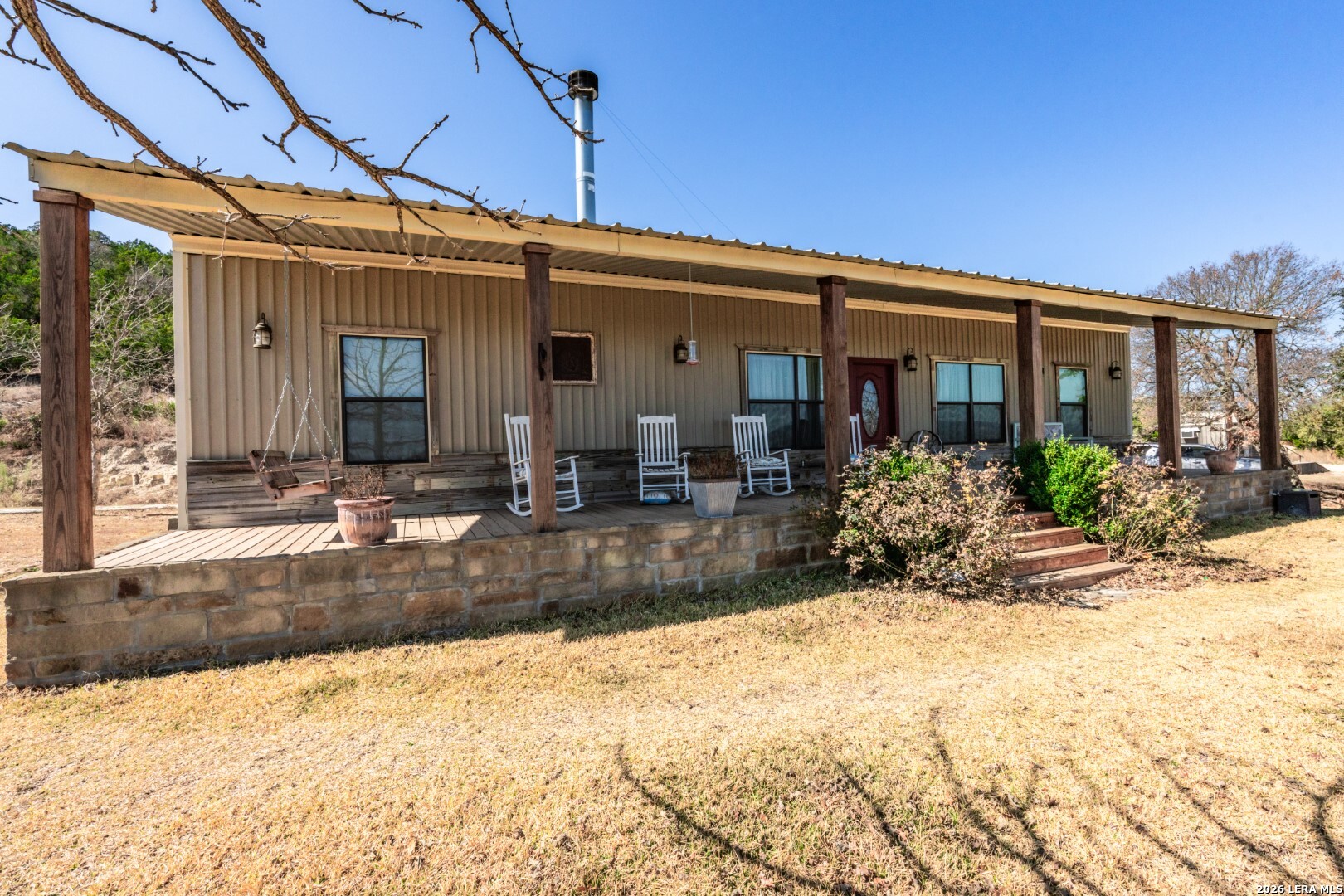 1079 County Road 357 Utopia, TX 78884 - Photo 3 of 36 a view of a house with a patio