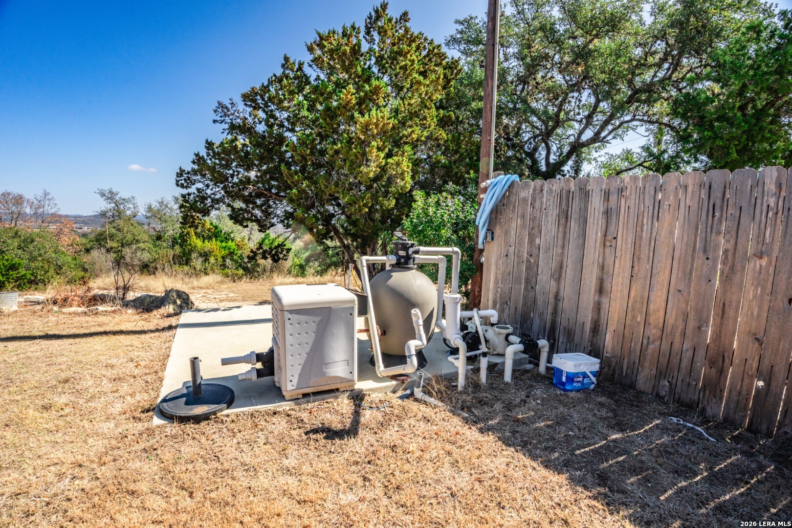 1079 County Road 357 Utopia, TX 78884 - Photo 34 of 36 a view of backyard with a table and chairs