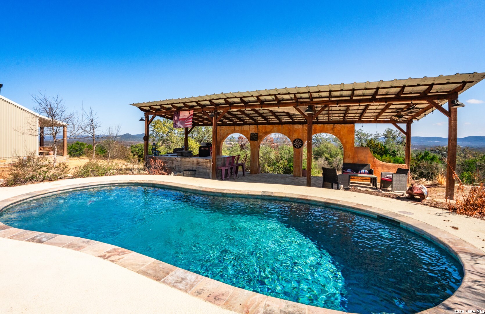 1079 County Road 357 Utopia, TX 78884 - Photo 4 of 36 a view of swimming pool with a patio