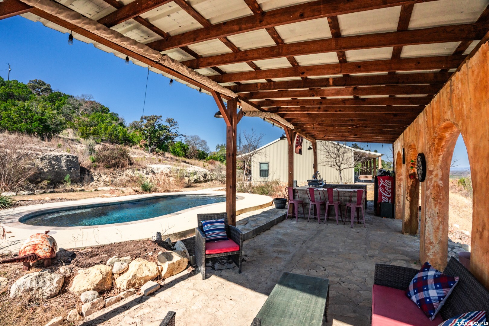 1079 County Road 357 Utopia, TX 78884 - Photo 5 of 36 a view of a chairs and table in the patio