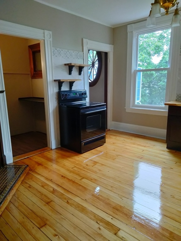 764 Rock Street, Unit 2 Fall River, MA 02720 - Photo 12 of 17 a bedroom with a bed and a window