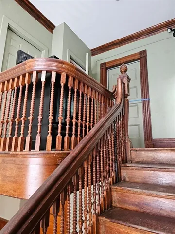 a view of a house with wooden floor and a large window