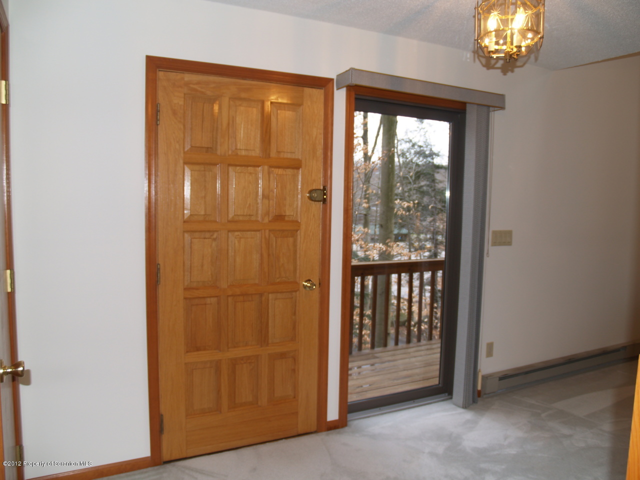 3062 Northgate Road Lake Ariel, PA 18436 - Photo 21 of 22 an empty room with windows wooden floor and door