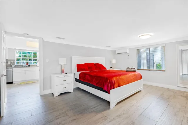 a bedroom with a bed and furniture