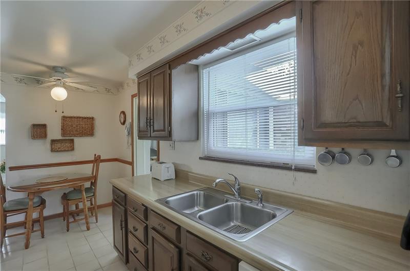 203 Gass Road Pittsburgh, PA 15229 - Photo 11 of 25 A sun-filled window above the sink looks over the rear yard.
