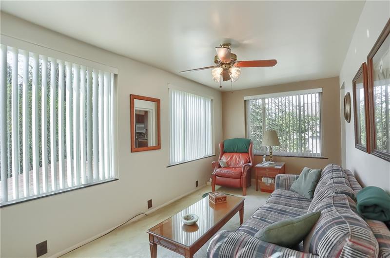 203 Gass Road Pittsburgh, PA 15229 - Photo 13 of 25 Generous sunlight floods the family room off the kitchen.
