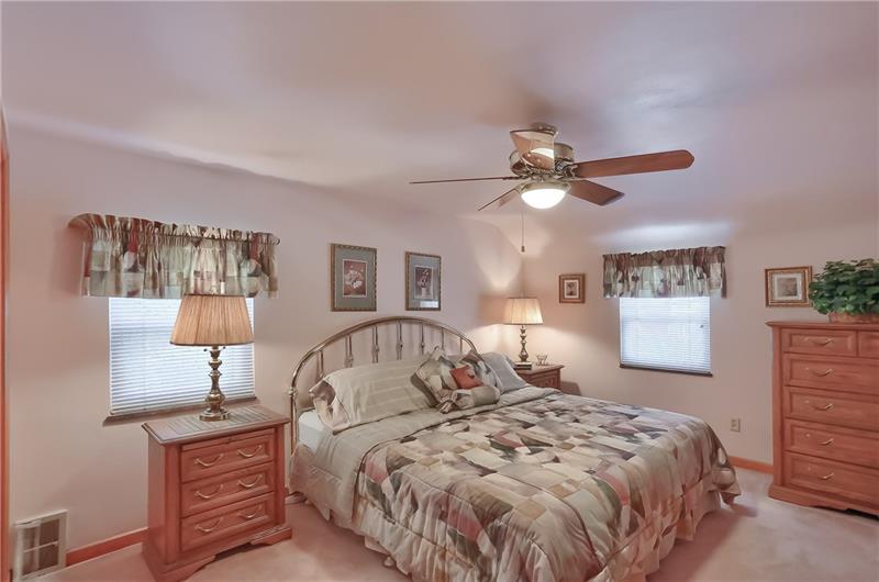 203 Gass Road Pittsburgh, PA 15229 - Photo 14 of 25 A roomy master bedroom features bright windows, large closet and a sitting area.