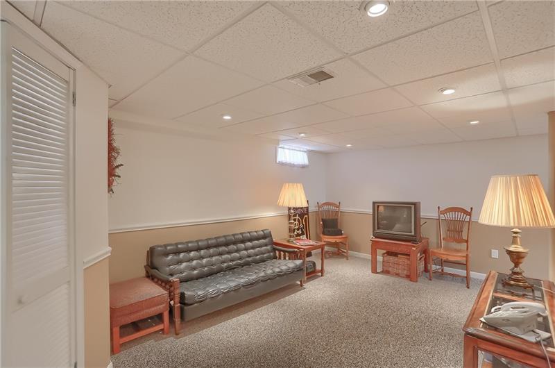203 Gass Road Pittsburgh, PA 15229 - Photo 18 of 25 A lower level game room features bright windows, neutral tones and a chair rail.