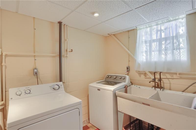 203 Gass Road Pittsburgh, PA 15229 - Photo 21 of 25 The lower level features a large laundry room with a bright window and generously sized laundry tub.