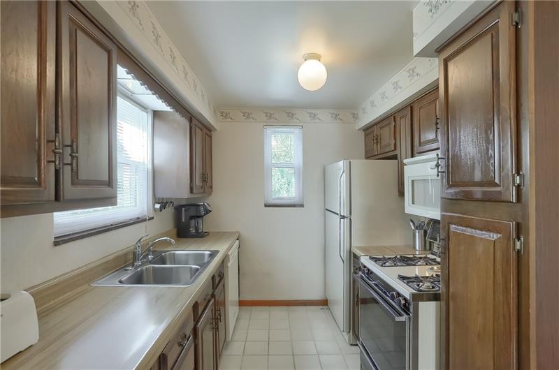 203 Gass Road Pittsburgh, PA 15229 - Photo 8 of 25 The kitchen is the heart of the home and provides ample cabinetry and counter space for your meal creations.