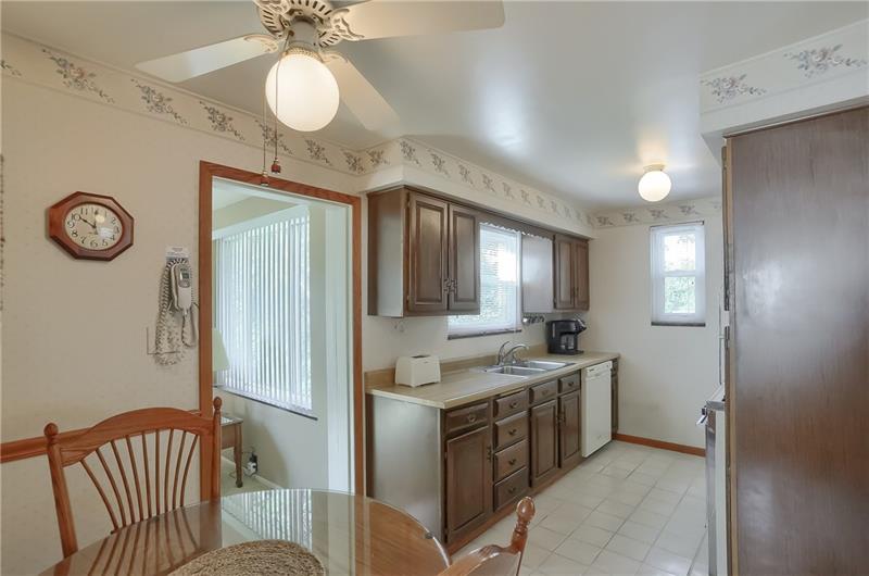 203 Gass Road Pittsburgh, PA 15229 - Photo 9 of 25 The kitchen features an eat in dining area and access to the family room.