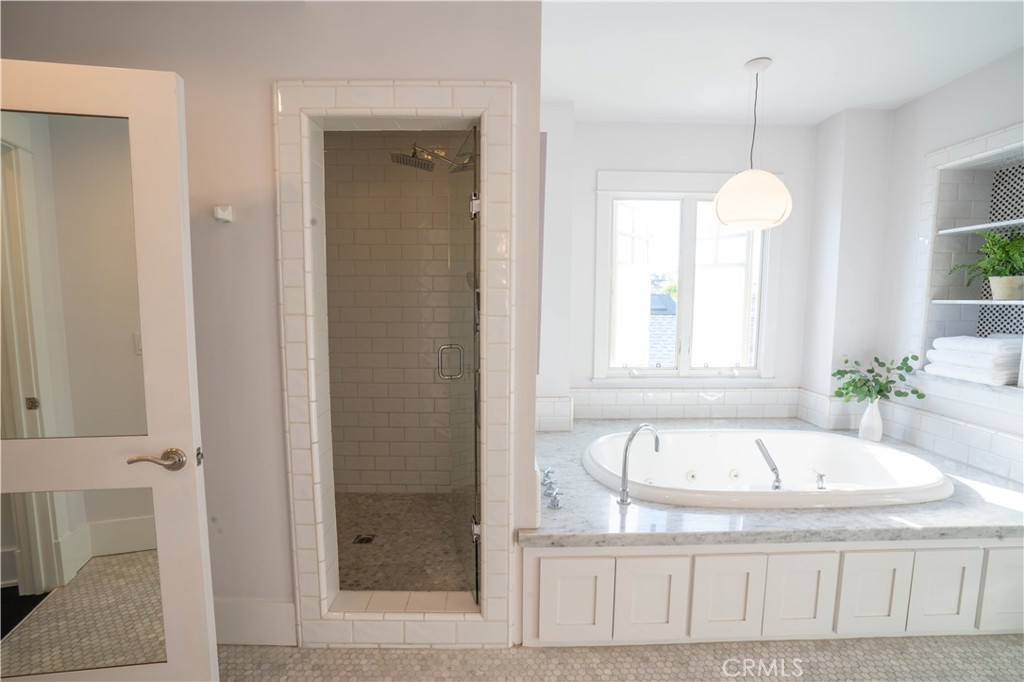 562 24th Place Hermosa Beach, CA 90254 - Photo 24 of 75 a bathroom with a tub sink and window