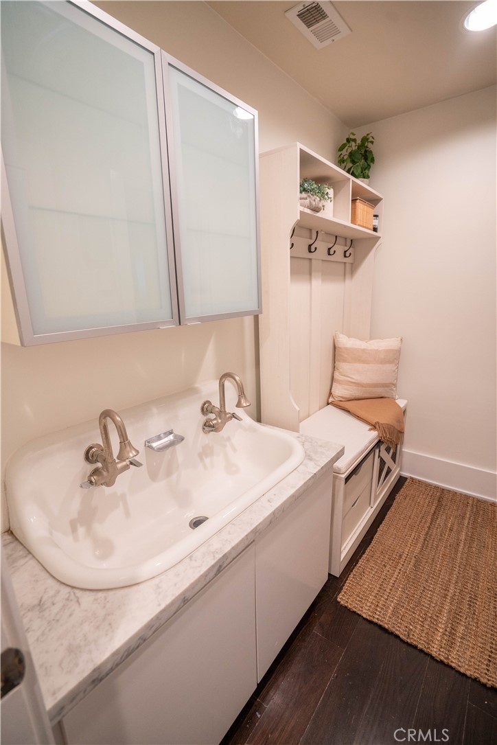 562 24th Place Hermosa Beach, CA 90254 - Photo 42 of 75 a bathroom with a sink and a mirror