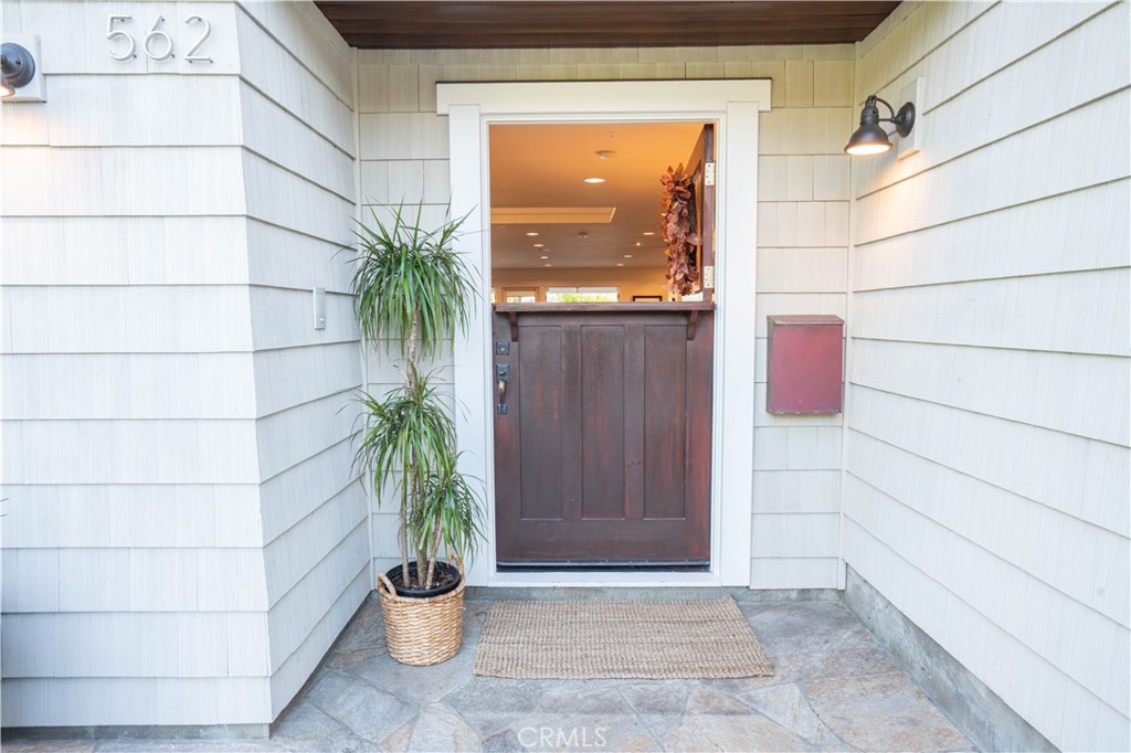 562 24th Place Hermosa Beach, CA 90254 - Photo 46 of 75 a potted plant sitting in front of a glass door