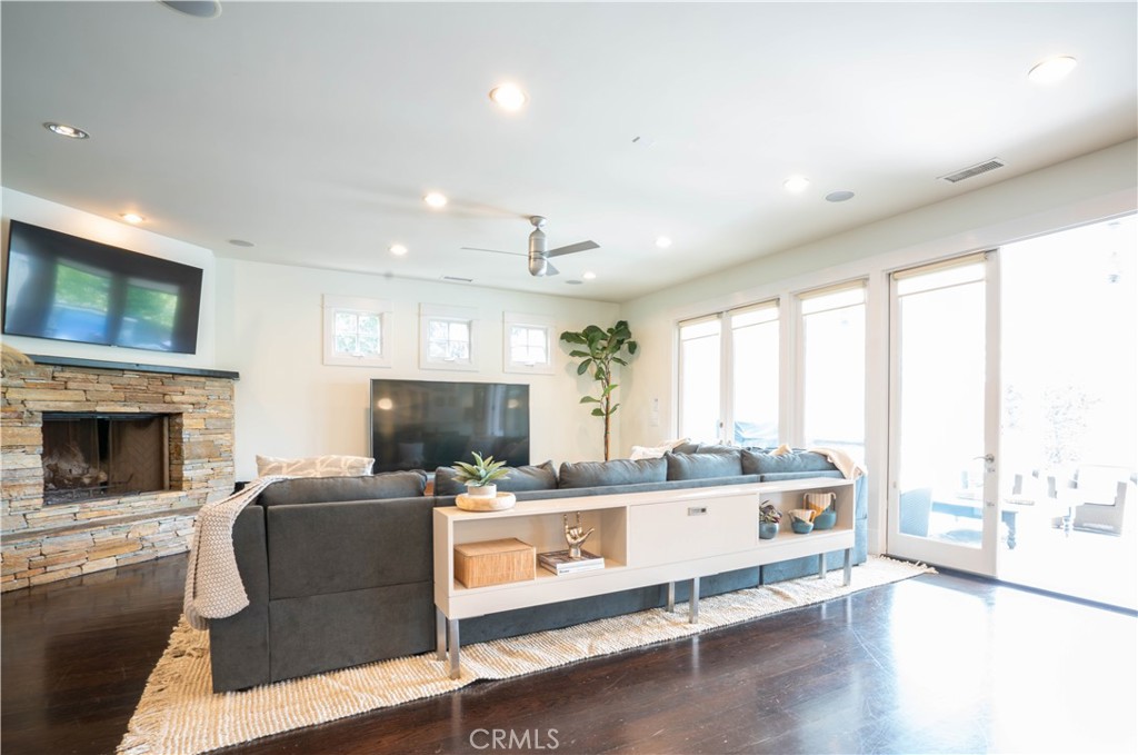 562 24th Place Hermosa Beach, CA 90254 - Photo 5 of 75 a living room with furniture a fireplace and a flat screen tv