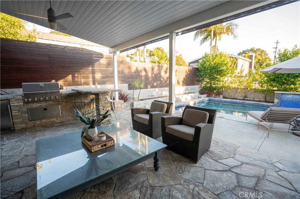 562 24th Place Hermosa Beach, CA 90254 - Photo 53 of 75 a living room with furniture a rug and a floor to ceiling window