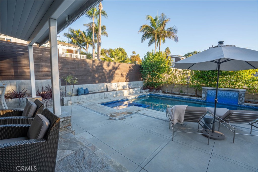 562 24th Place Hermosa Beach, CA 90254 - Photo 59 of 75 a swimming pool with outdoor seating and a potted plant