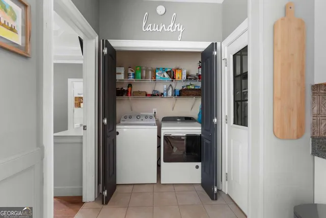 a kitchen with refrigerator and cabinets