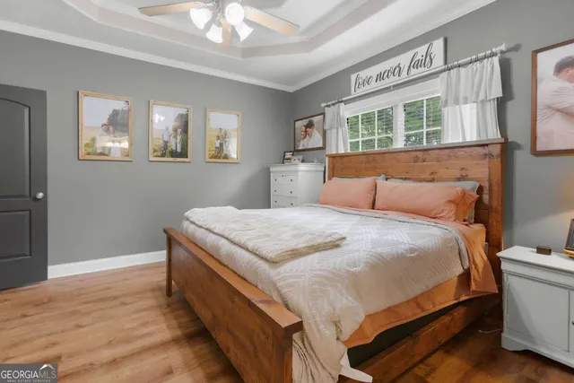 a bathroom with a sink a toilet and a large mirror
