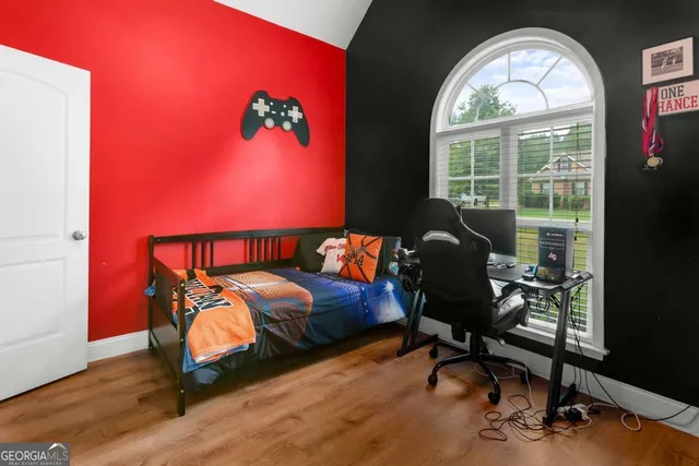 a bathroom with a sink mirror vanity and toilet