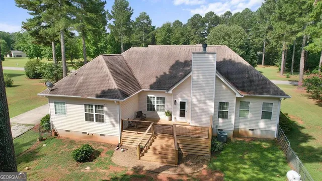 a aerial view of a house with a yard