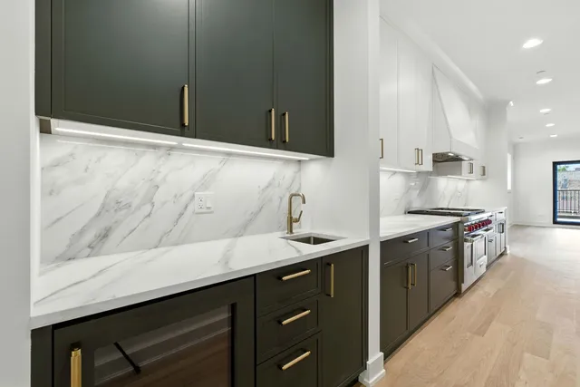 a kitchen with a sink and cabinets