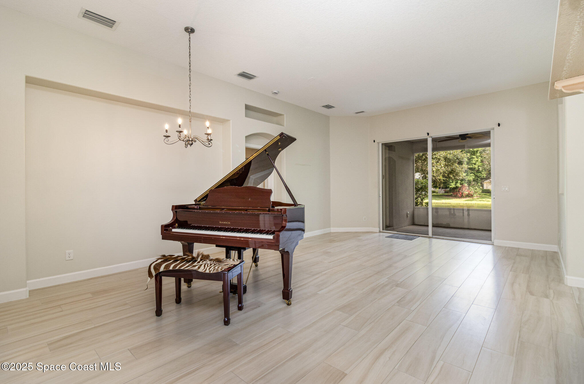 652 Hatteras Court Southwest Vero Beach, FL 32968 - Photo 12 of 48 a living room with furniture and wooden floor