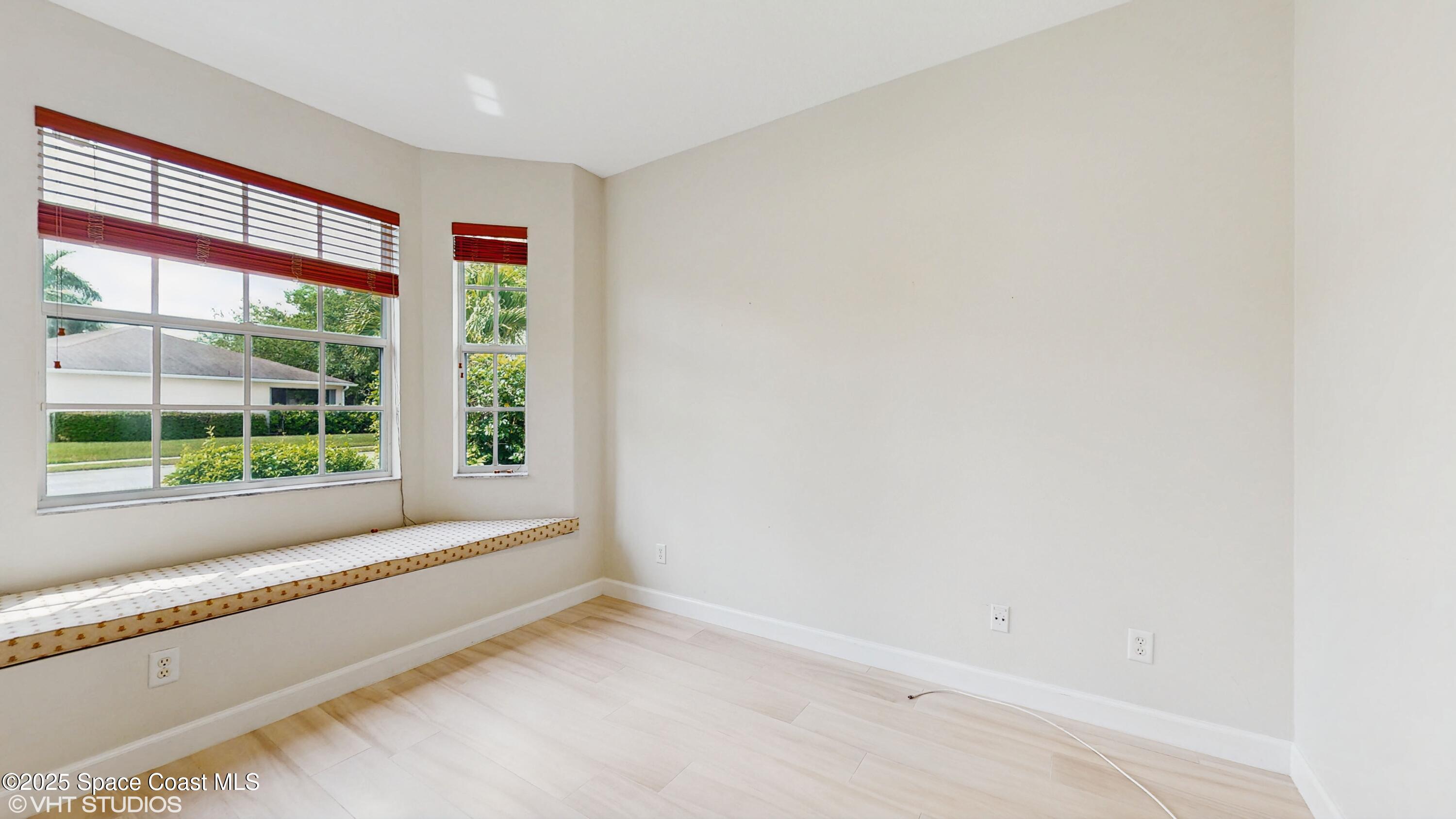 652 Hatteras Court Southwest Vero Beach, FL 32968 - Photo 23 of 48 a view of room with window and front door