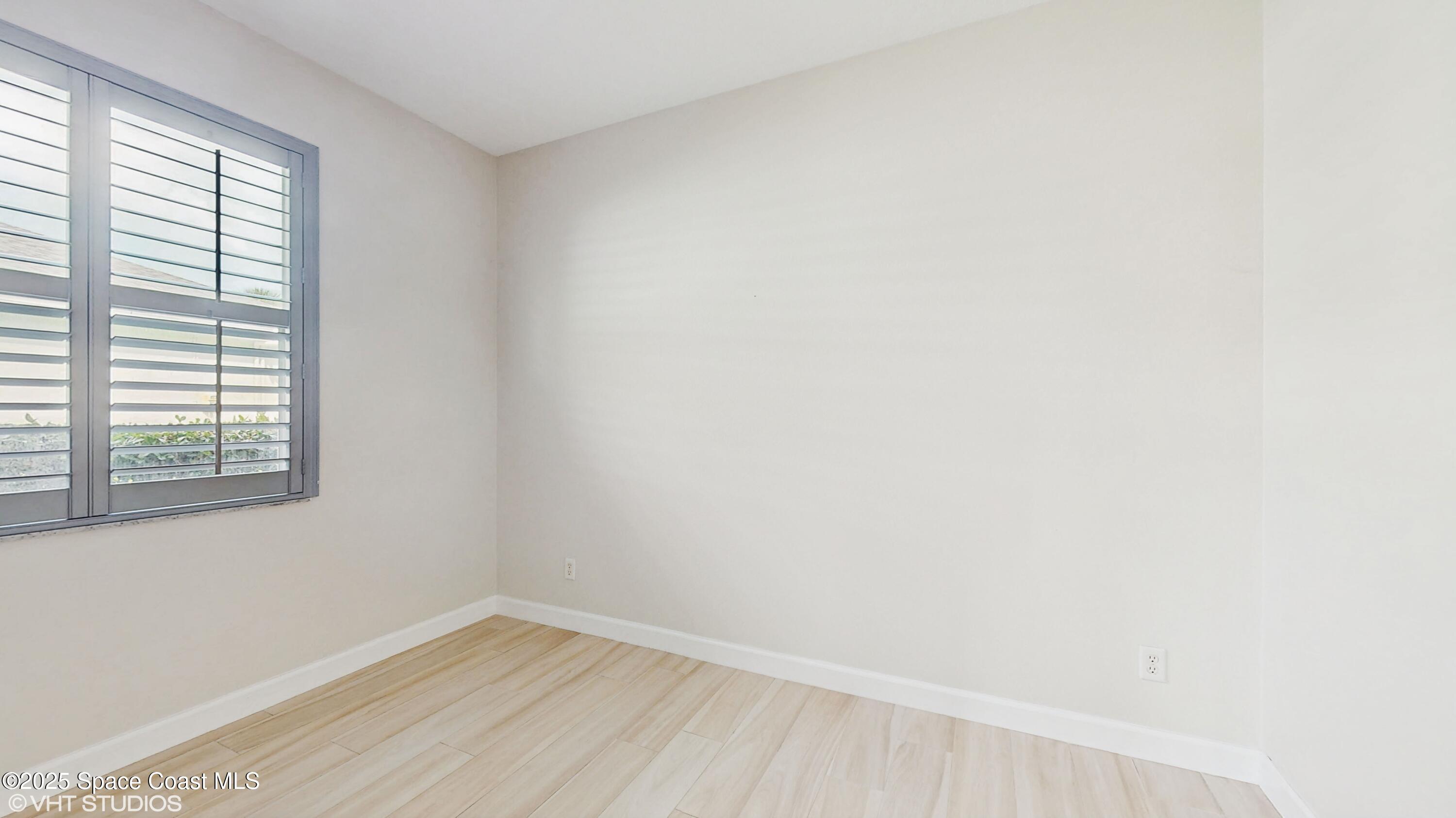 652 Hatteras Court Southwest Vero Beach, FL 32968 - Photo 26 of 48 a view of an empty room with a window