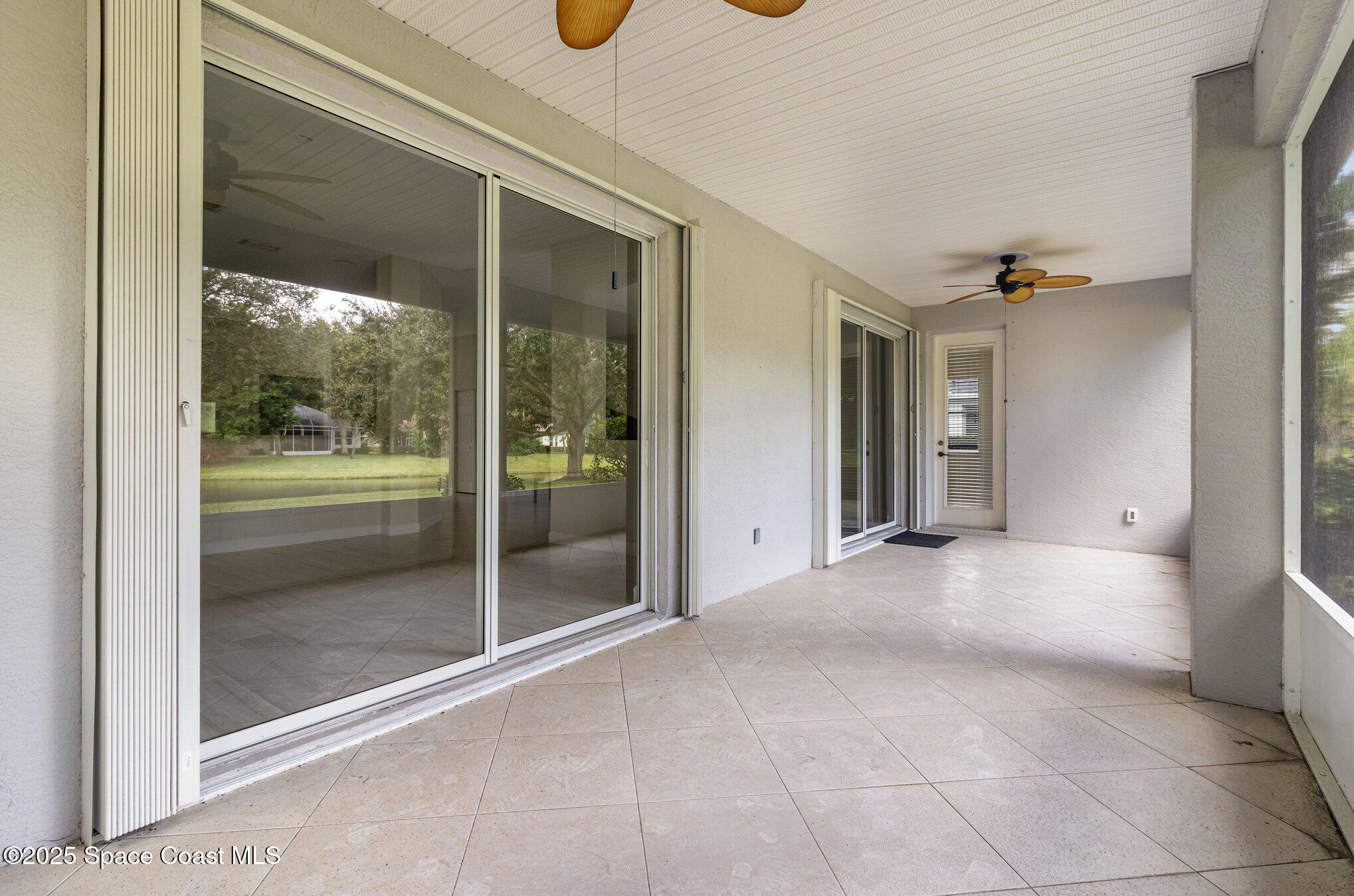652 Hatteras Court Southwest Vero Beach, FL 32968 - Photo 27 of 48 a view of a glass door with a door