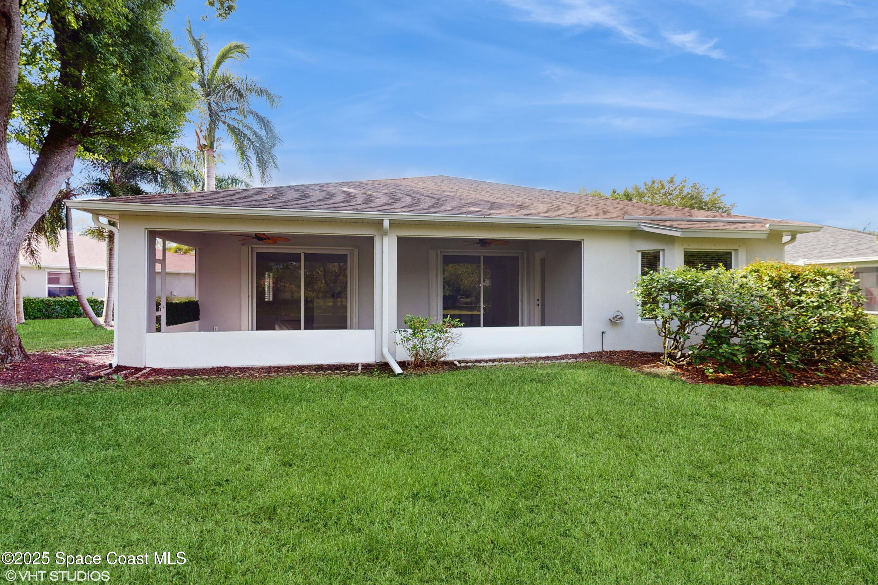 652 Hatteras Court Southwest Vero Beach, FL 32968 - Photo 33 of 48 a view of a house with a yard and plants