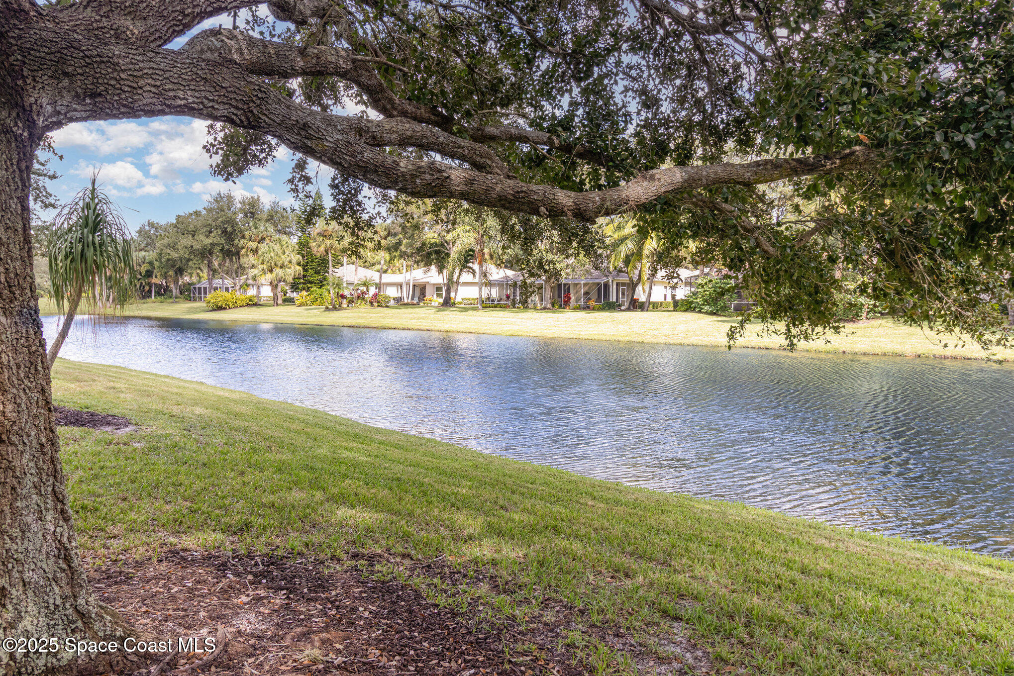 652 Hatteras Court Southwest Vero Beach, FL 32968 - Photo 36 of 48 a view of a lake view of a house