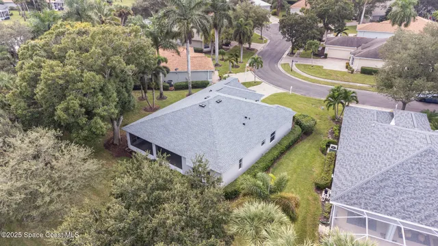 an aerial view of house with outdoor space and swimming pool