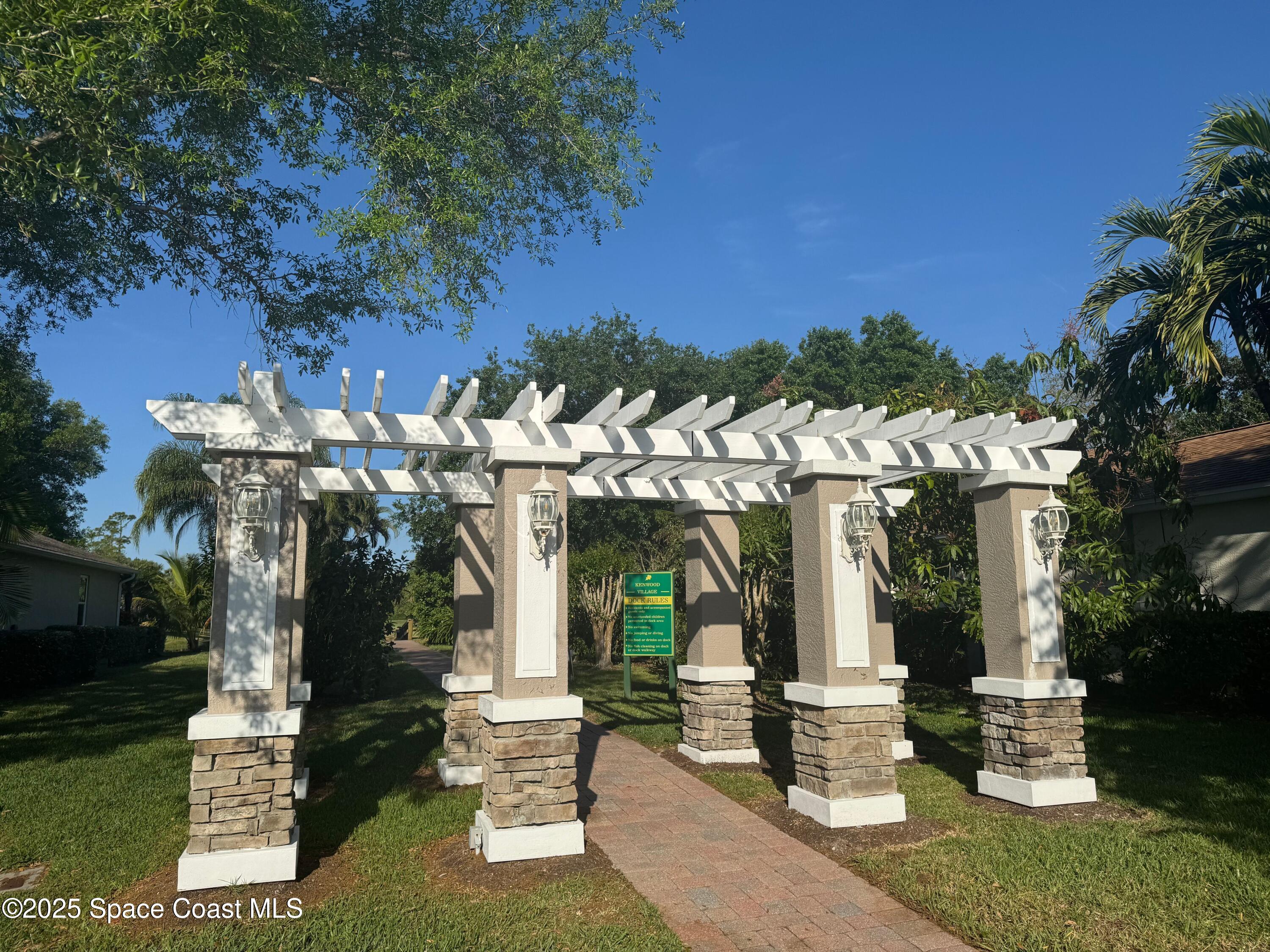 652 Hatteras Court Southwest Vero Beach, FL 32968 - Photo 42 of 48 a front view of a building with street view