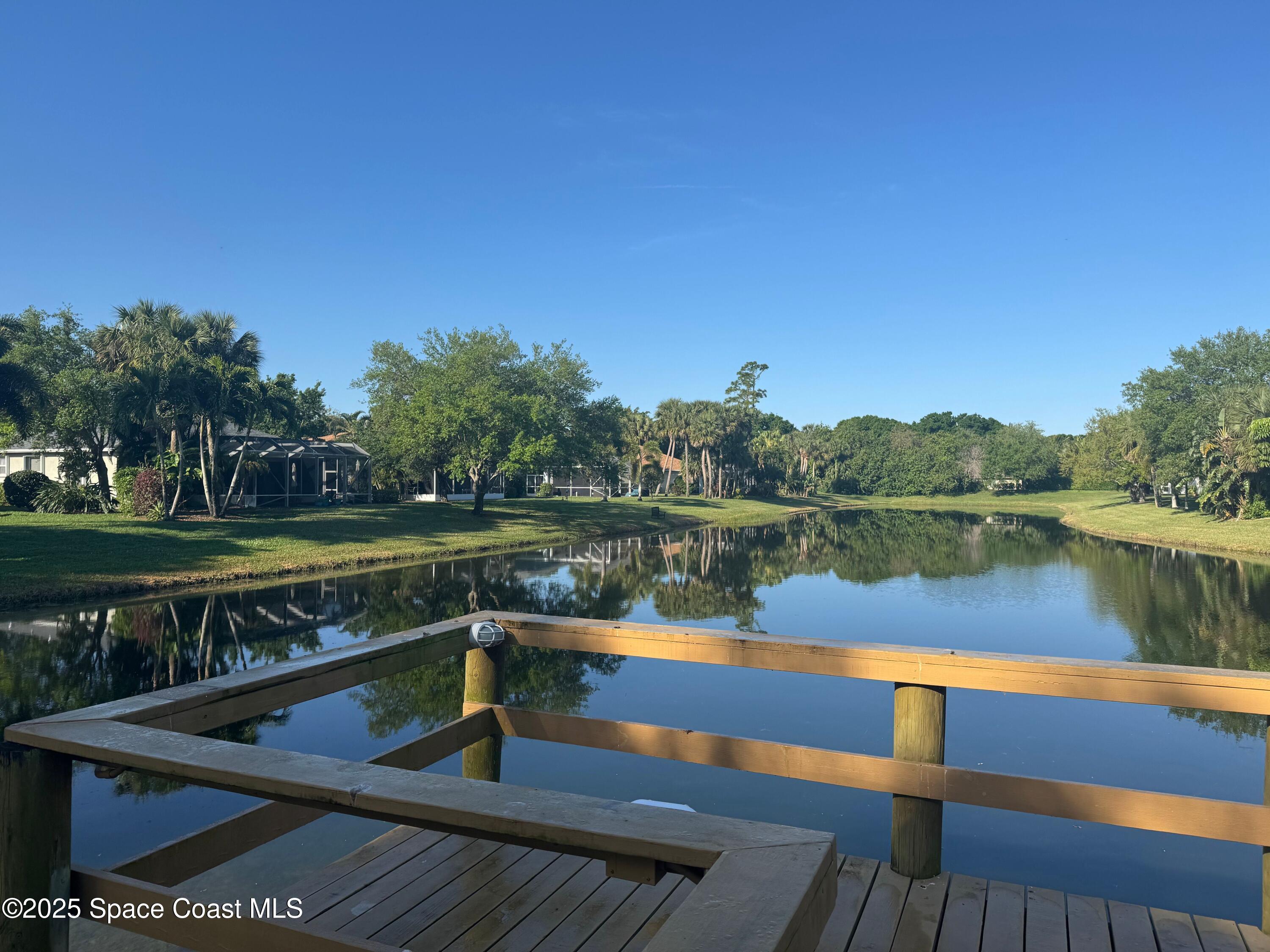 652 Hatteras Court Southwest Vero Beach, FL 32968 - Photo 46 of 48 a view of a lake with a deck