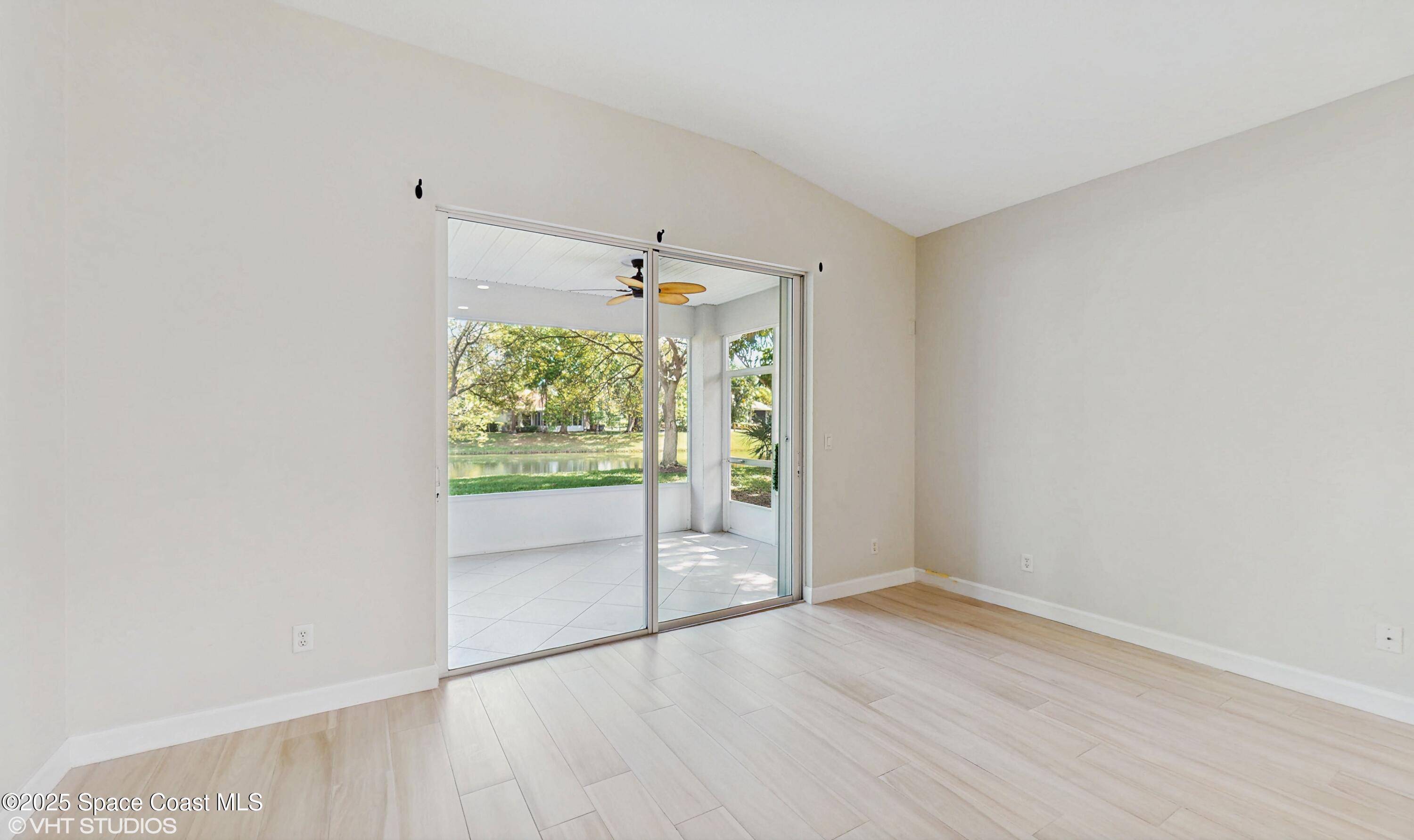 652 Hatteras Court Southwest Vero Beach, FL 32968 - Photo 9 of 48 wooden floor in an empty room