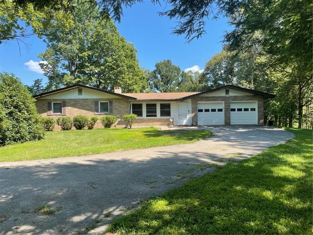 673 Dinco Road Derry, PA 15627 - Photo 1 of 21 a view of house with yard and green space