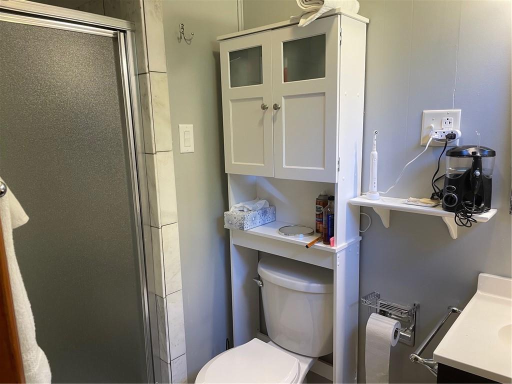 673 Dinco Road Derry, PA 15627 - Photo 15 of 21 a bathroom with a granite countertop toilet sink and shower