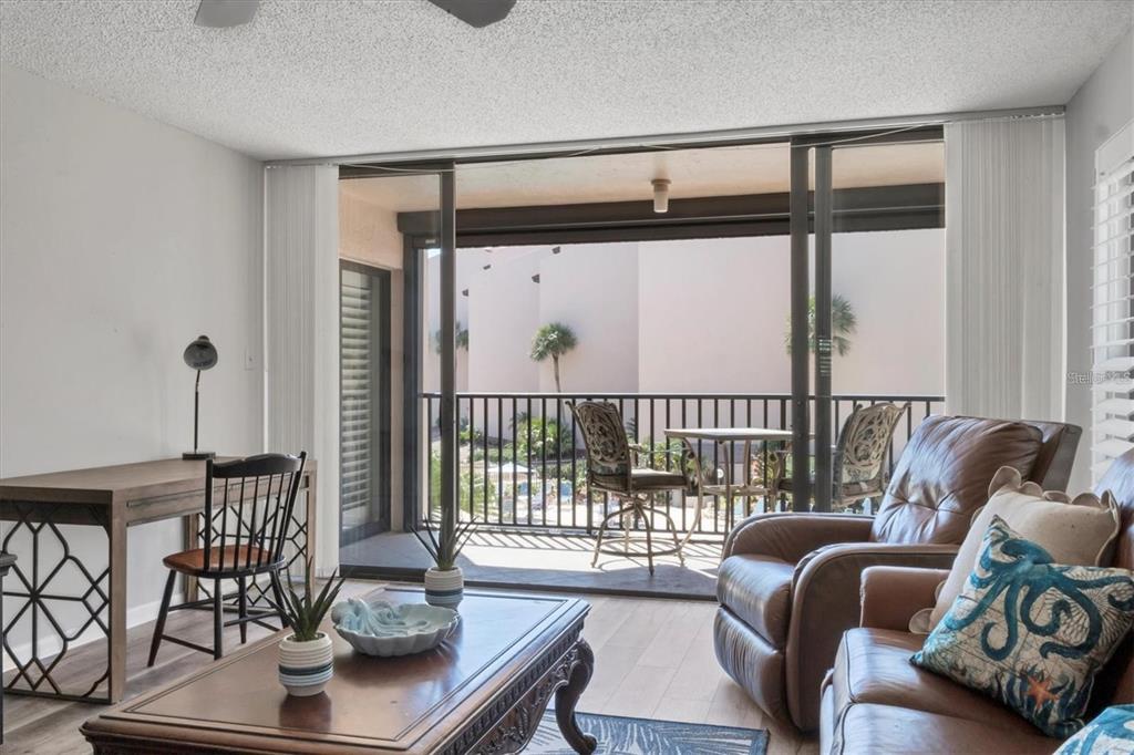 6480 Midnight Pass Road, Unit 311 Sarasota, FL 34242 - Photo 11 of 48 a living room with furniture