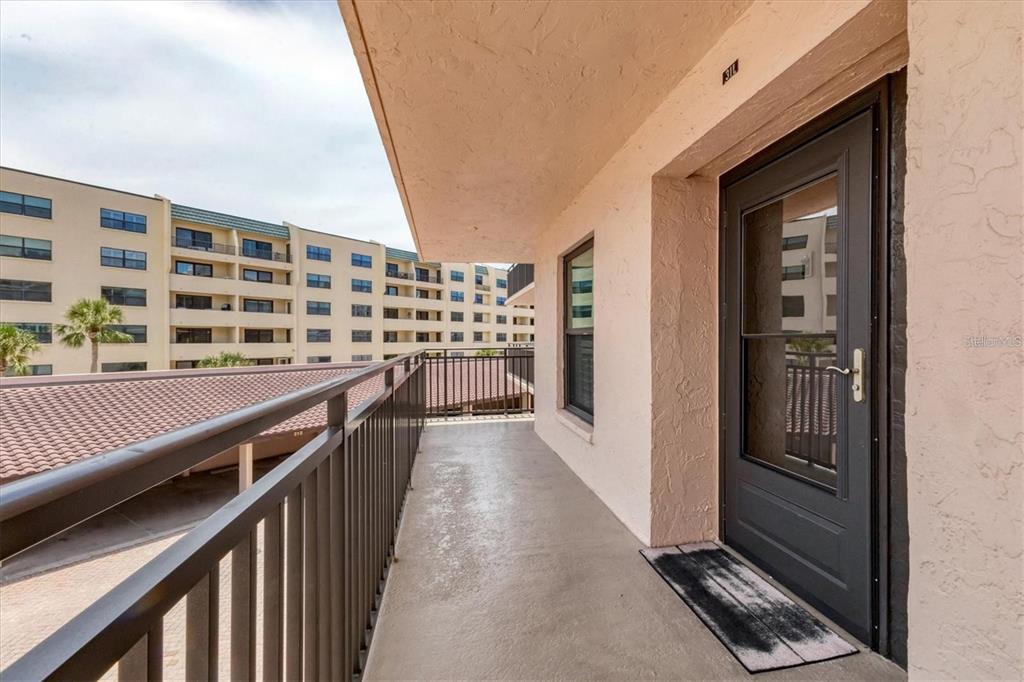 6480 Midnight Pass Road, Unit 311 Sarasota, FL 34242 - Photo 2 of 48 a view of balcony with wooden floor