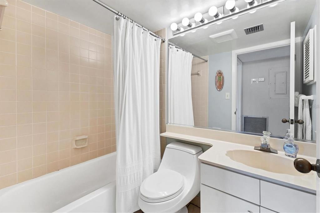 6480 Midnight Pass Road, Unit 311 Sarasota, FL 34242 - Photo 30 of 48 a bathroom with a sink a toilet and shower