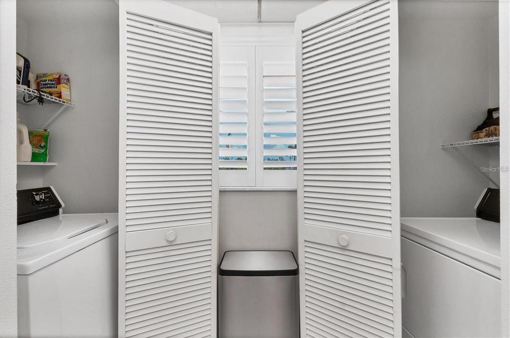 6480 Midnight Pass Road, Unit 311 Sarasota, FL 34242 - Photo 31 of 48 a utility room with dryer and washer